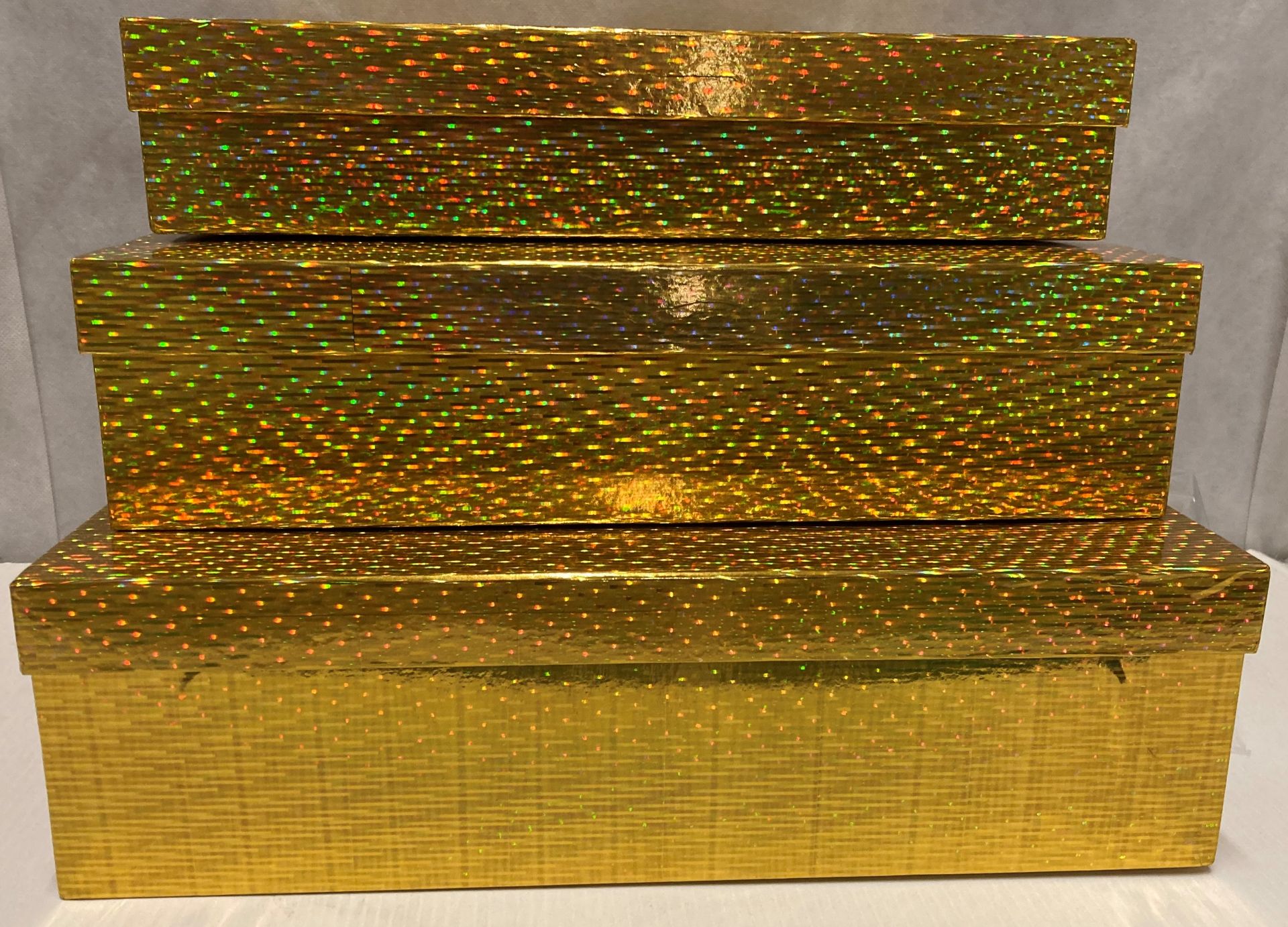 6 x sets of 3 gold halogram gift boxes (30cm x 39cm down to 35cm x 26cm)