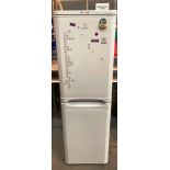 An Indesit A+ class tall upright fridge freezer