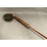 An Impregnated two piece fly fishing rod 8'6" long complete with a Hardy Bros Ltd England 'The