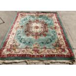 A green beige and pink patterned Chinese rug 275cm x 230cm