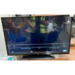 A Bush HDMI DLED32165 HD 32" flat screen TV complete with remote control