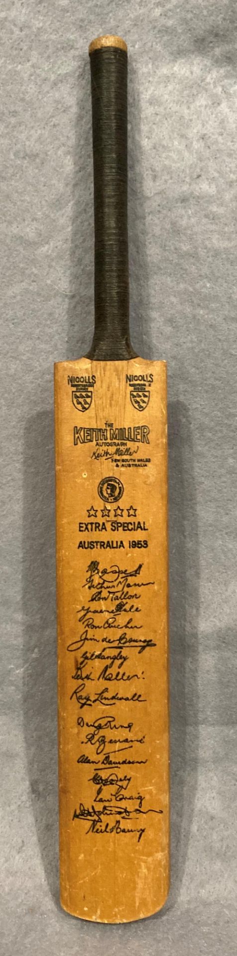 A miniature cricket 'Keith Miller' cricket bat featuring the facsimile autographs of the 1953
