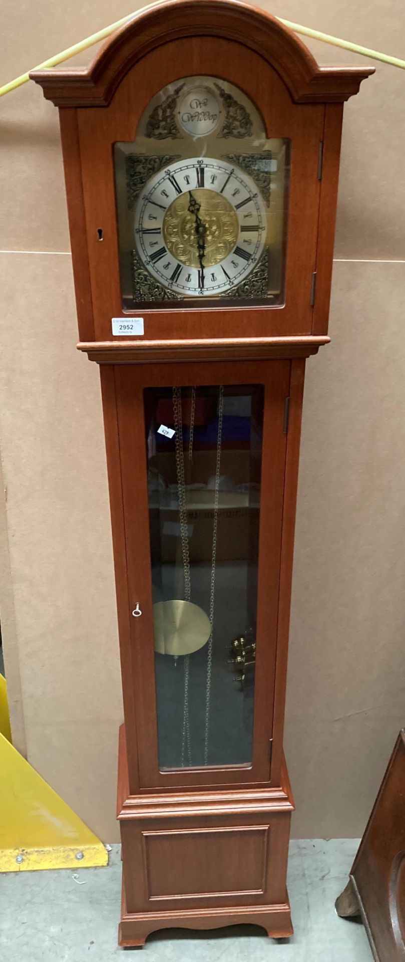 A modern mahogany stained long case clock with brass and metal face inscribed Wm Widdop 160cm x
