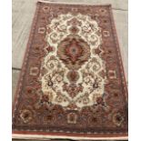 Turkish wool carpet by Merinos in salmon and beige pattern approx 255cm x 160cm