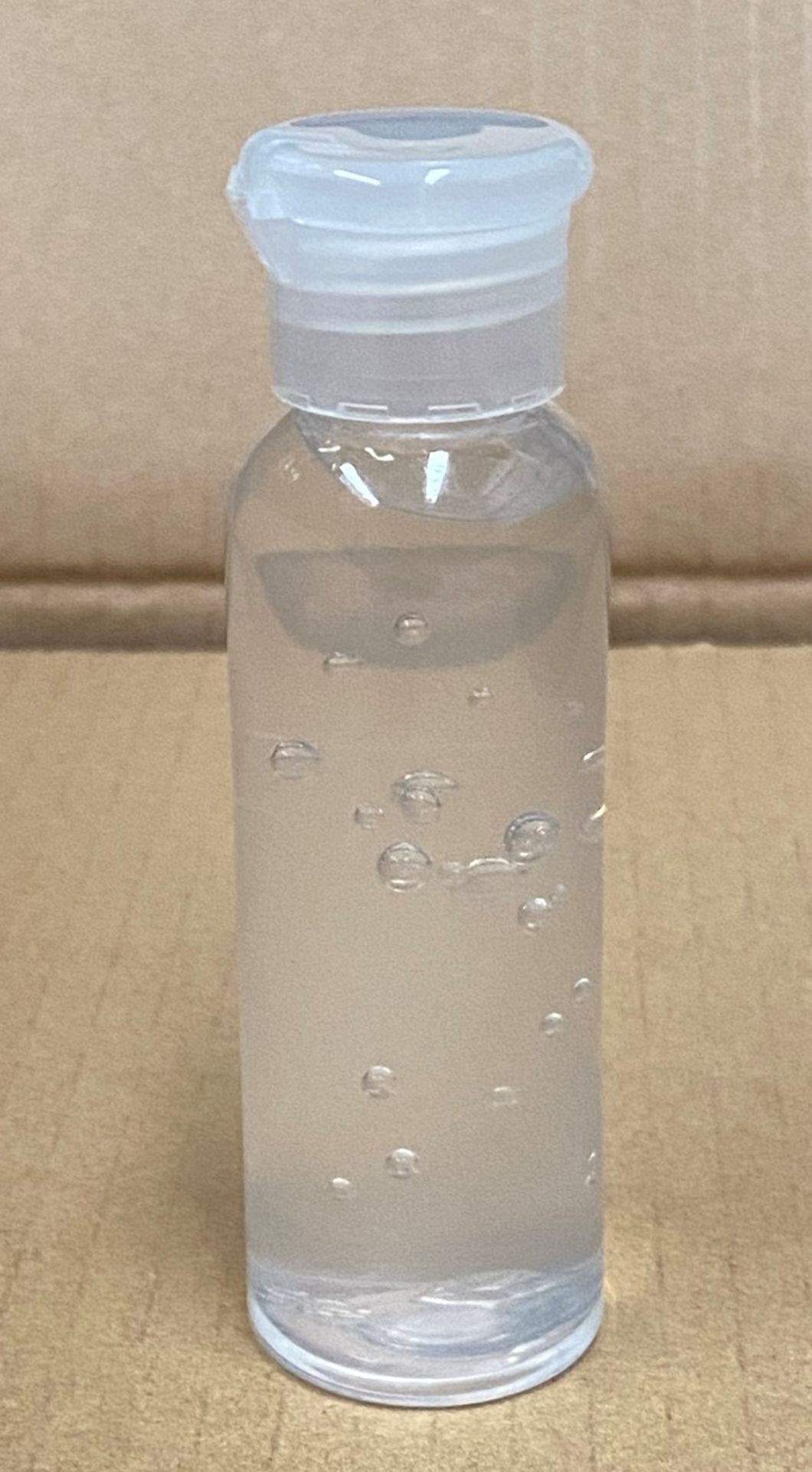 384 x 50ml flip top bottles of Rosdon Group UK hand sanitiser (Unlabelled clear plastic bottles) -