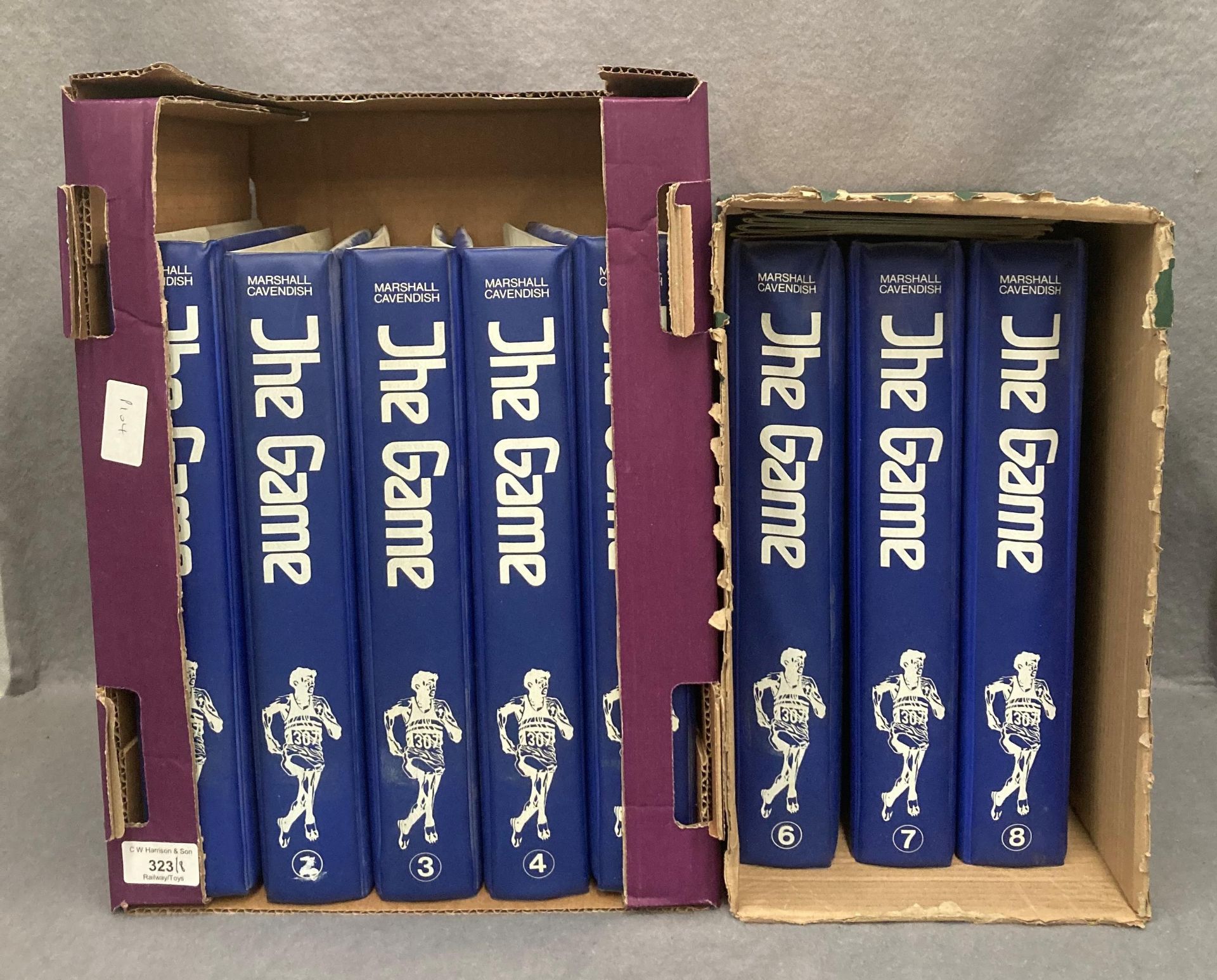 Eight blue plastic folders containing the Marshall Cavendish Encyclopedia of World Sports magazines