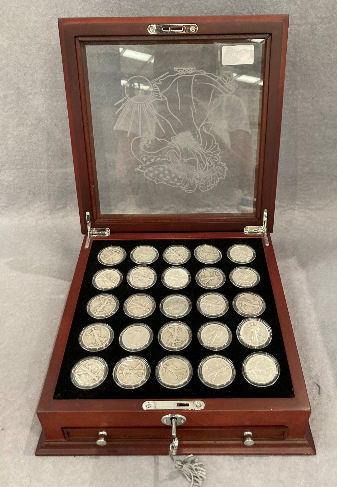 Collection of 25 silver Walking Liberty Half dollars from 1916-1947