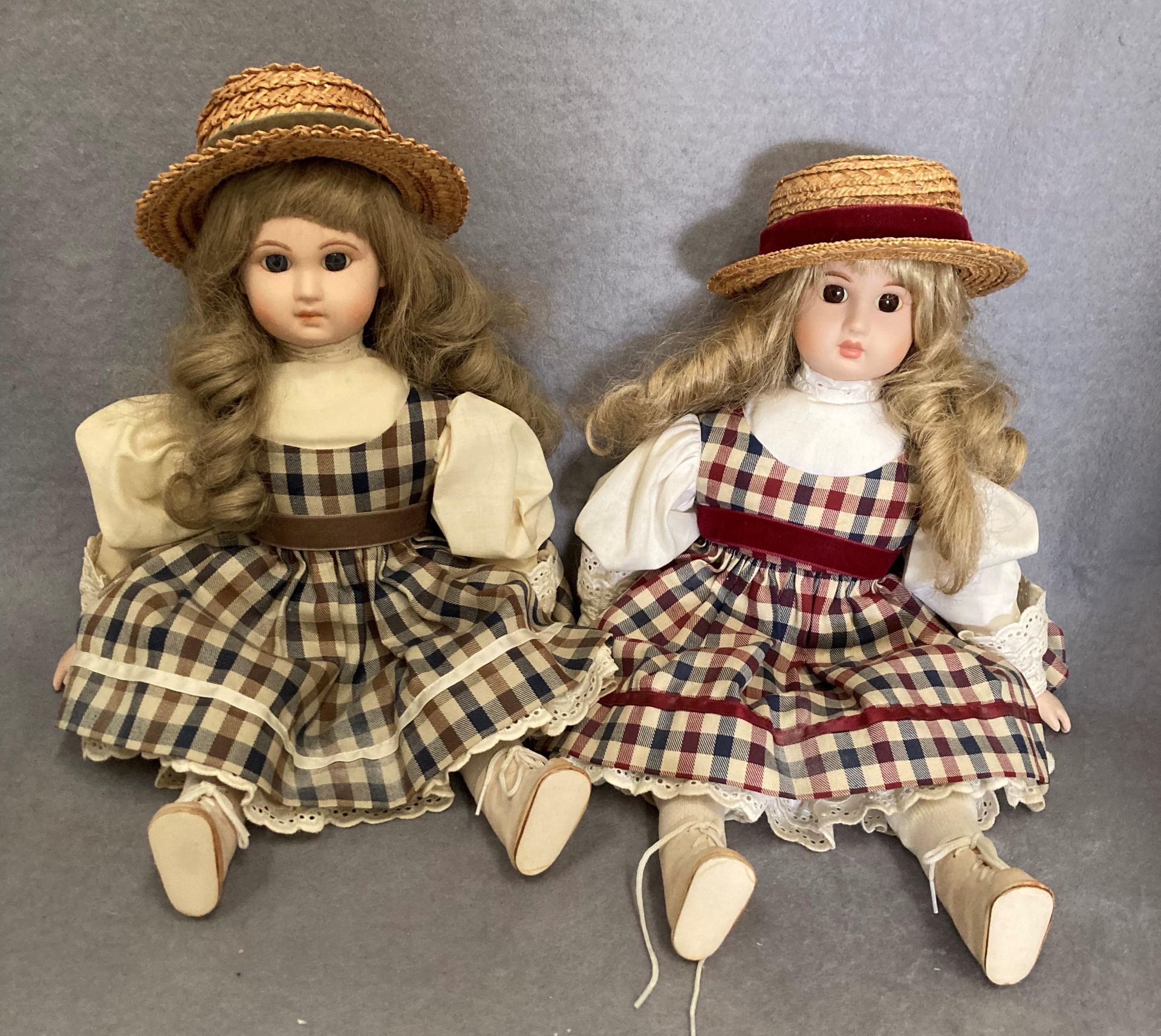 Two modern dolls with porcelain heads each 42cm long