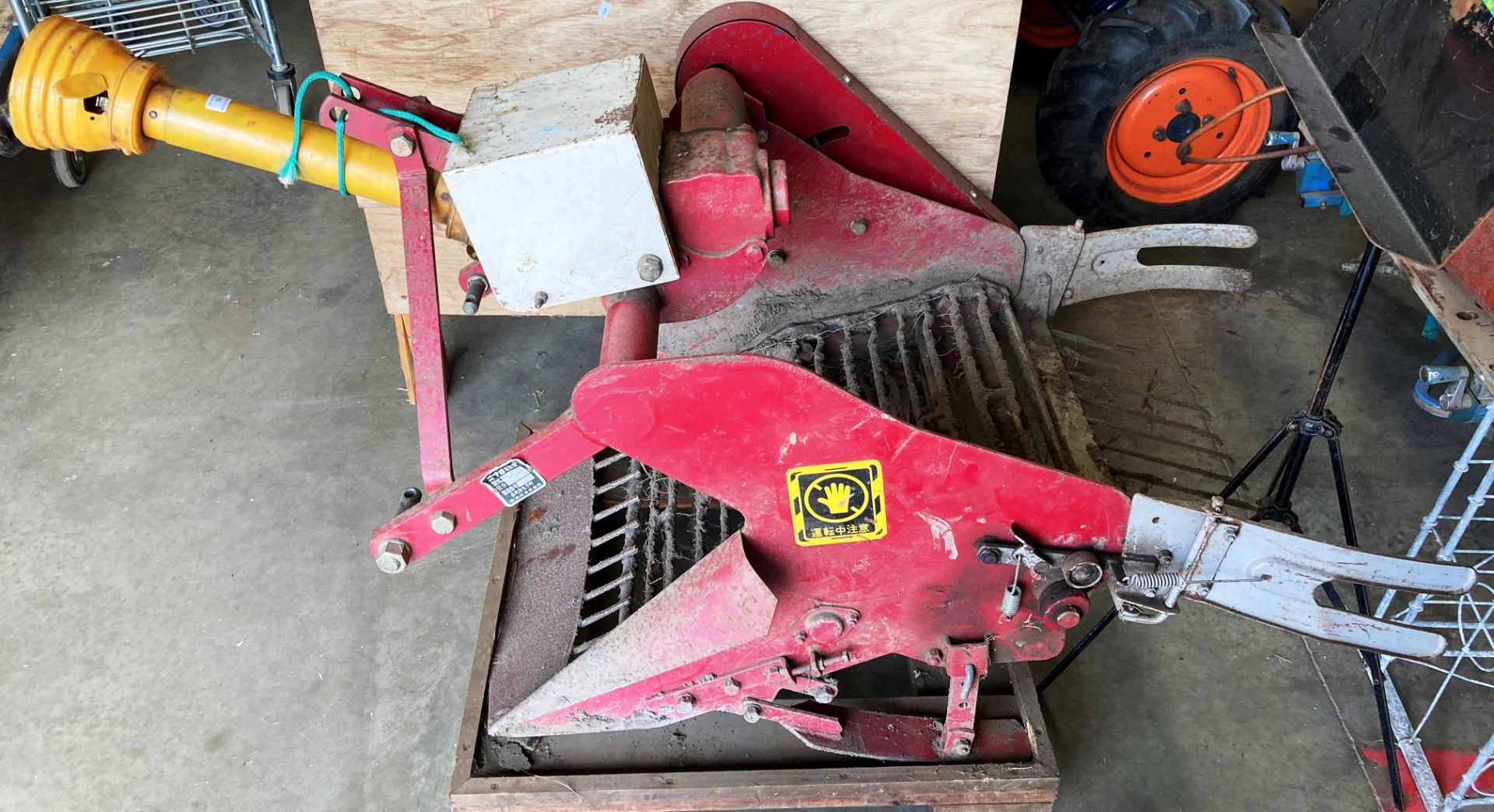 A NIPLO RED METAL POTATO PICKING ATTACHMENT model D-551 serial no.