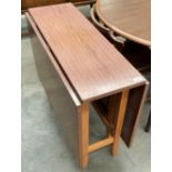 A Formica topped drop leaf kitchen table