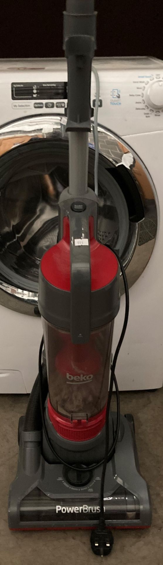 A Bek0 Powerbrush upright vacuum cleaner