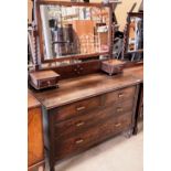 An oak three drawer mirror back dressing table 122cm