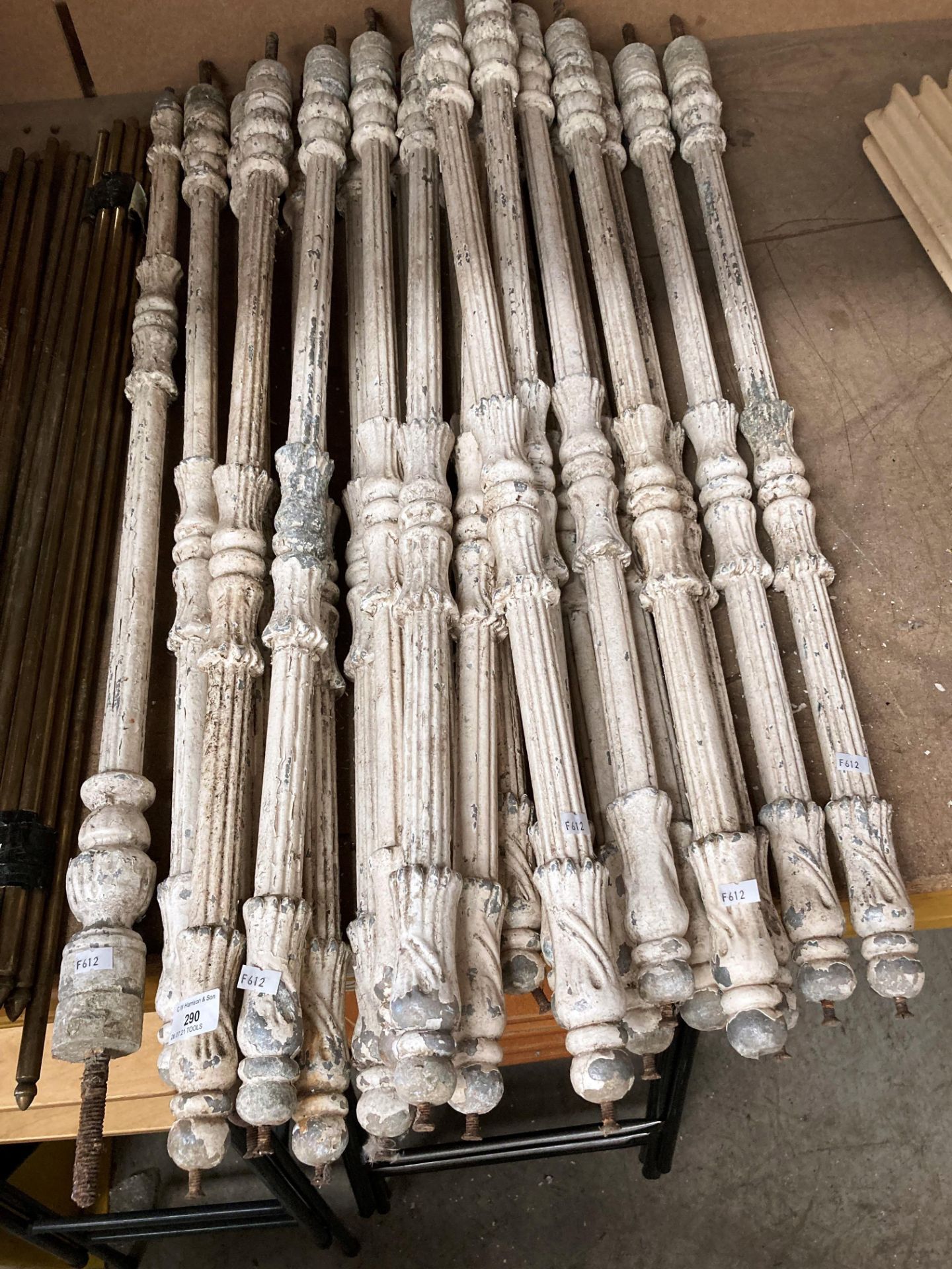 Twenty one white painted metal vintage stair spindles each 1m