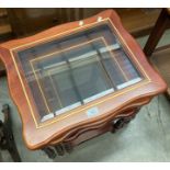 A wood finish nest of tables with glass top and a small reproduction sofa table (2)