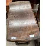 An oak drop leaf gate leg oval side table 60 x 90cm