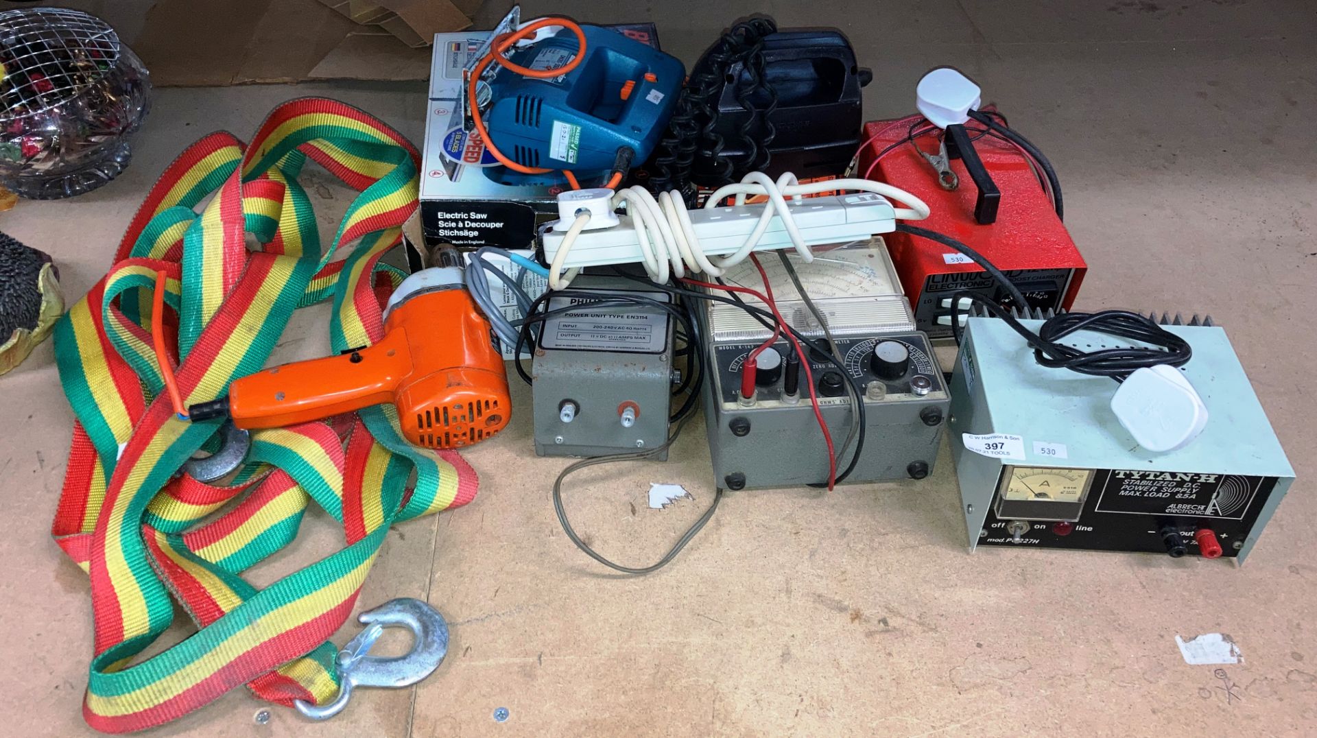 Contents to part of rack - power supplies, boost charger, jigsaw, drill etc.