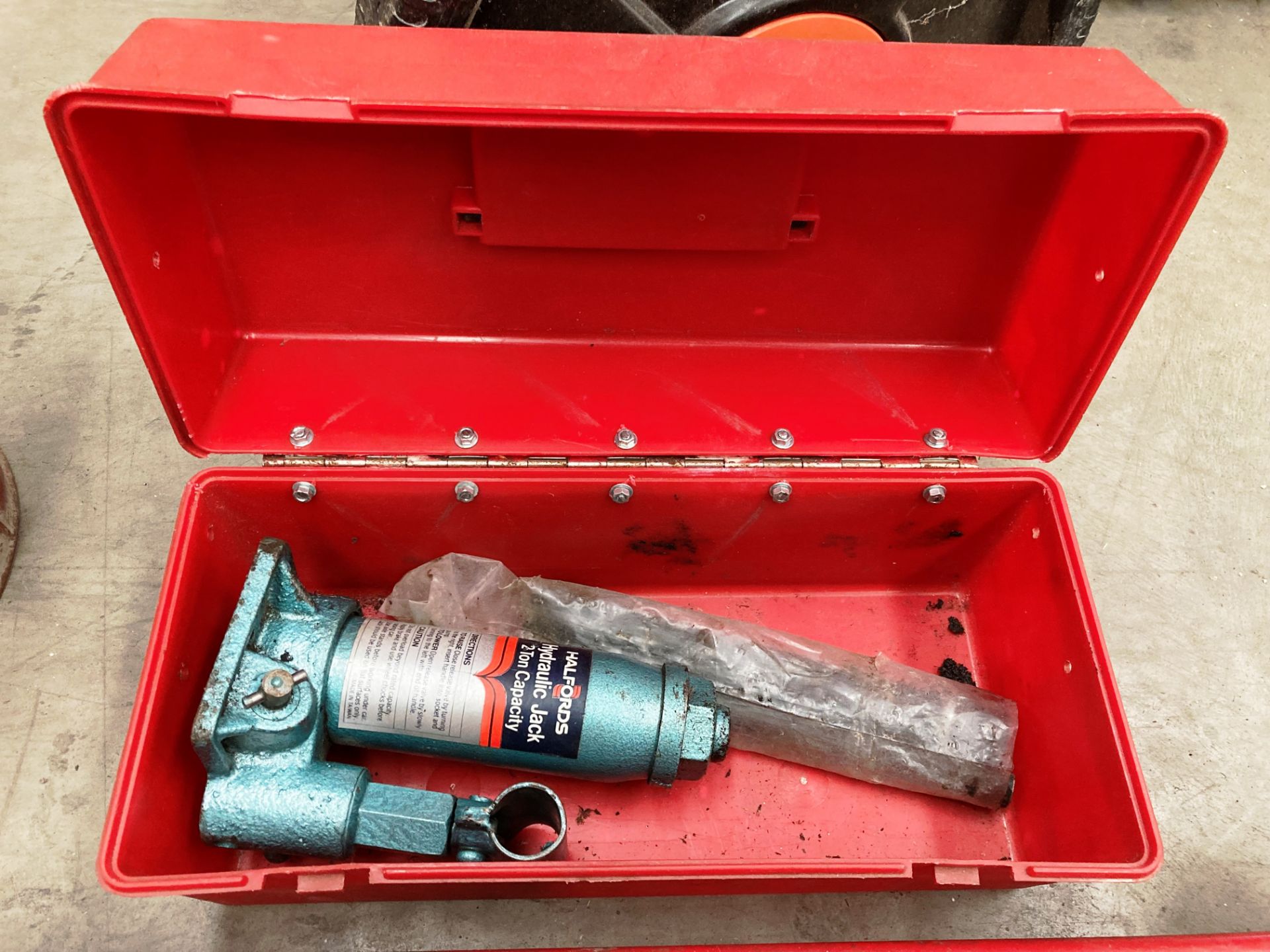 A Halfords two ton hydraulic jack in case