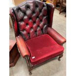 Am Oxblood leather deep buttoned wing back armchair with seat cushion re-upholstered in maroon