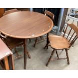 A circular oak finish dining table 104cm dia complete with four rail back dining chairs (5)