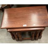 An oak Old Charm nest of three coffee tables