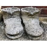 A pair of composition and concrete boot planters