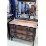 An oak three drawer mirror back dressing table 100cm