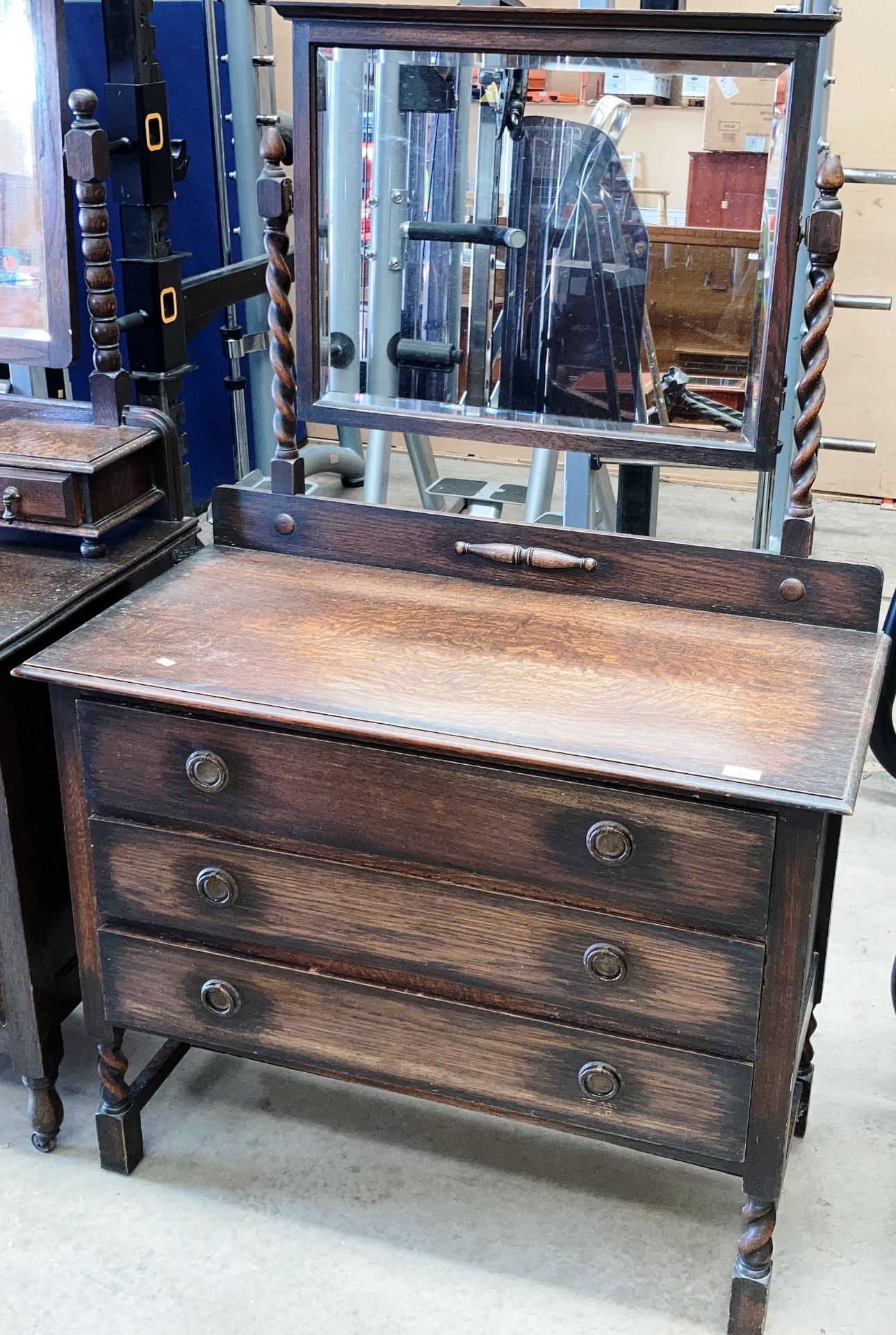 An oak three drawer mirror back dressing table 100cm
