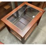 A medium wood finish coffee table 65 x 50cm