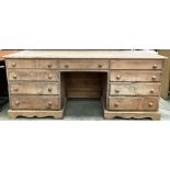 A large stripped pine nine drawer works desk 187cm x 63cm x 82cm high