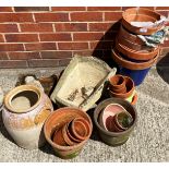 Quantity Terracotta plant pots, concrete wheel barrow planter (handles broken) etc.