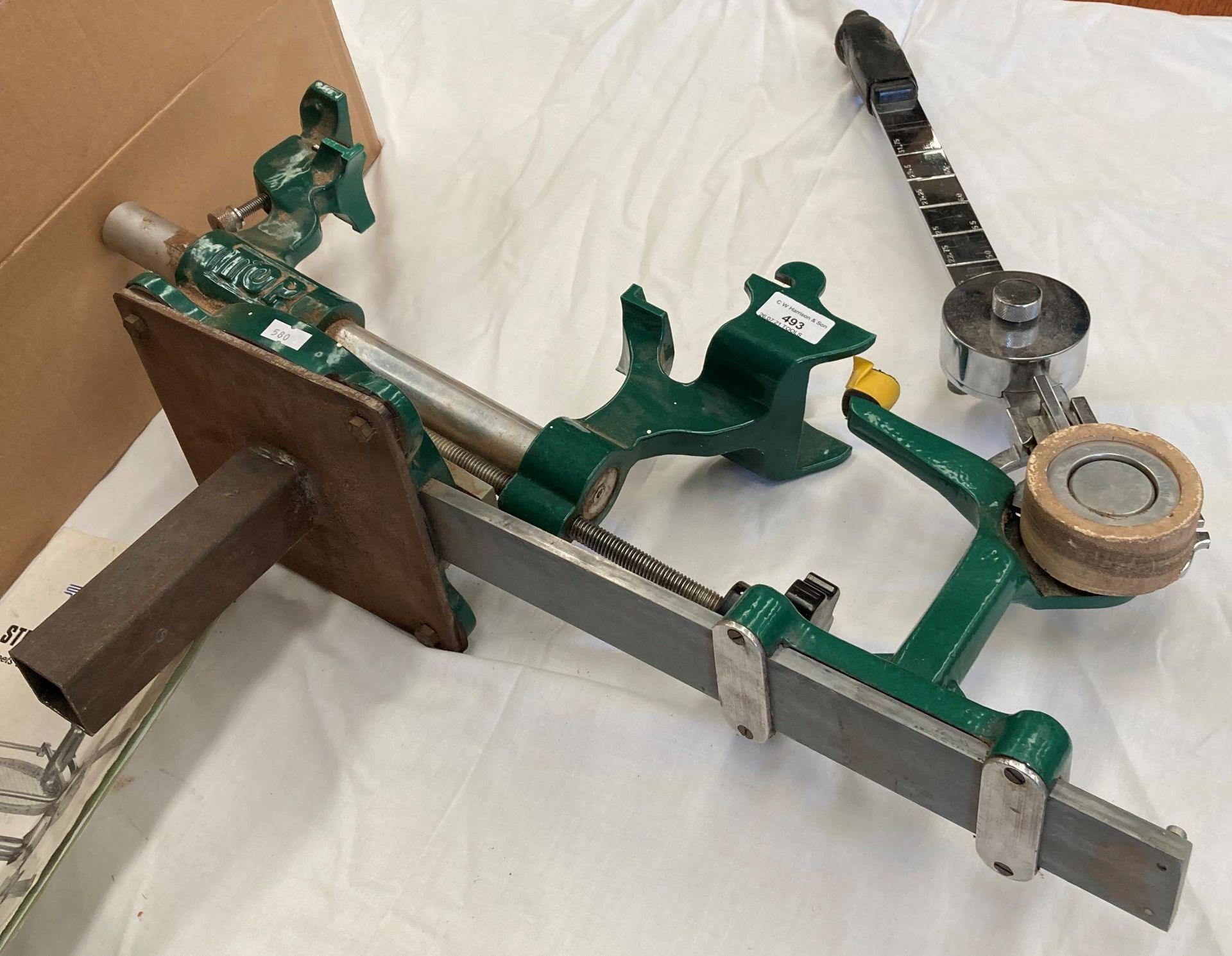 An Alfa Springs Ltd 'The Top' racquet stringing machine complete with manual and a quantity of