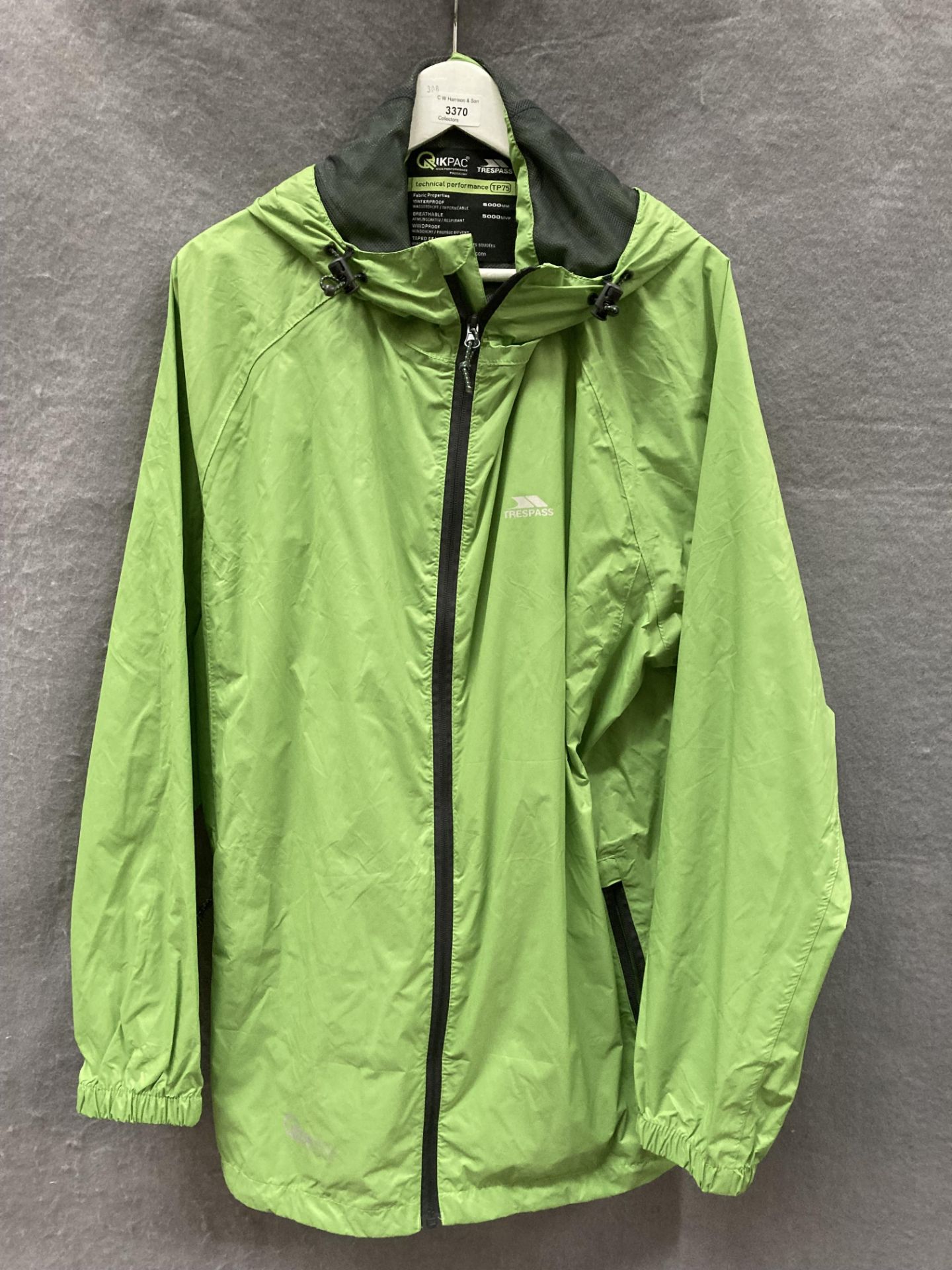 A Trespass Kwikpac TP75 lime green kagoule,