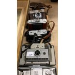 A Voightlander Vitoret camera in brown case, an Agfa Isolette camera in brown case,