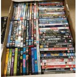 Contents to two trays - approximately 150 assorted DVDs/DVD box sets and Blu-ray discs - rated U -