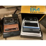 A Kodak EK4 Instant camera in box and a Kodak EK300 Instant camera in black vinyl bag (2)