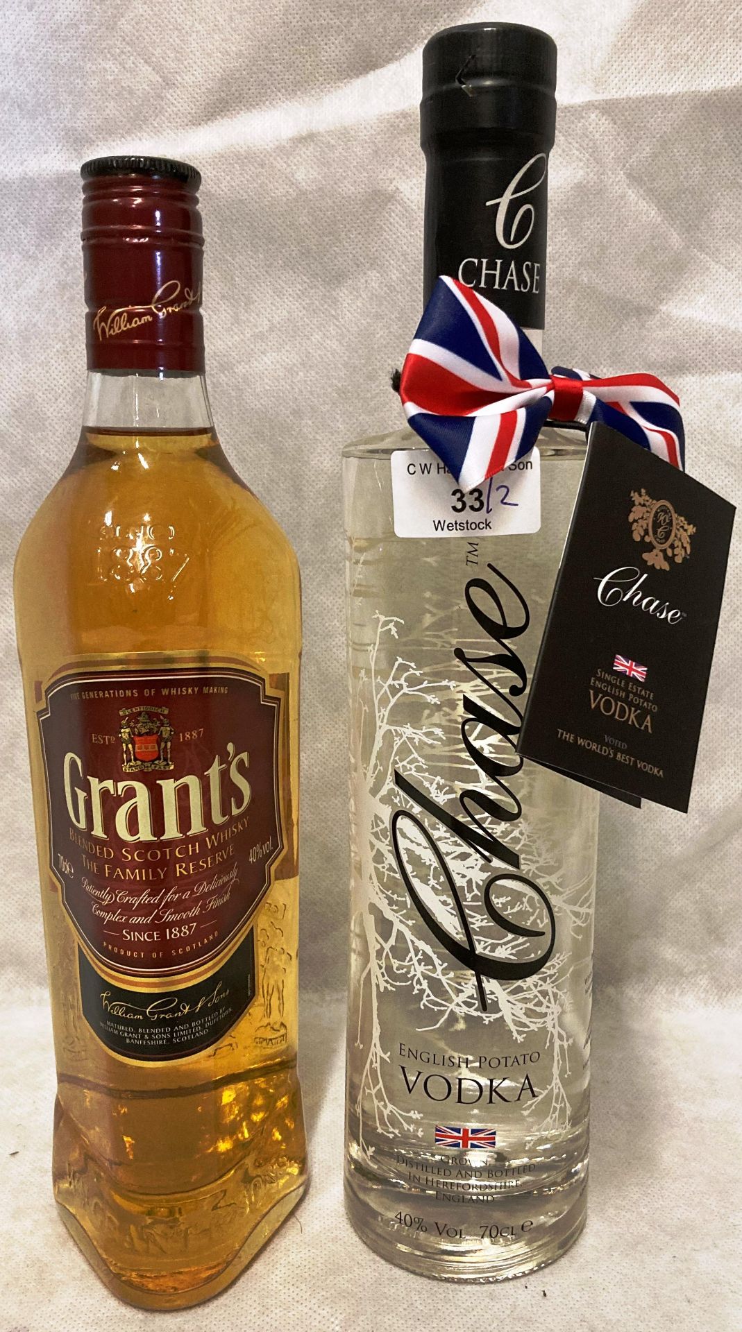 A 70cl bottle of Chase English Potato Vodka (40% volume) and a 70cl bottle of Grant's The Family