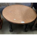 A hammered copper top low bar table 60cm dia