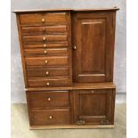 AN OAK TABLE TOP DENTAL CABINET with ten various sized drawers with brass handles and a recessed