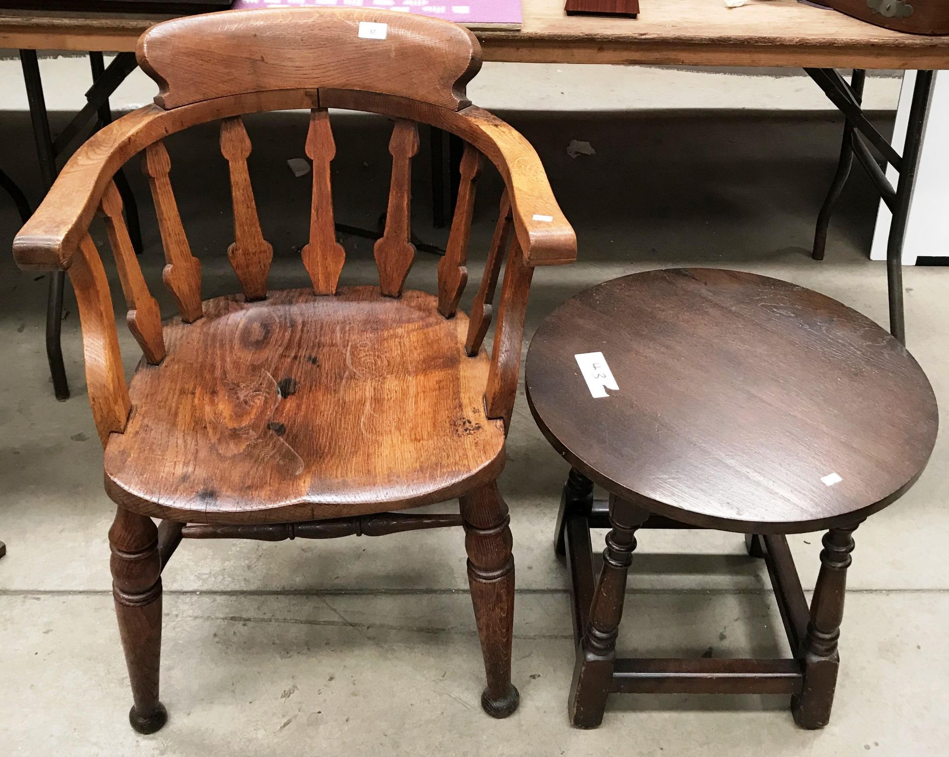 An oak office armchair and an oak circular side table (2)