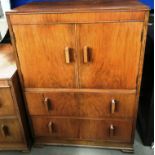 A walnut two piece bedroom suite comprising two door two drawer tall boy 76 x 105cm high and a