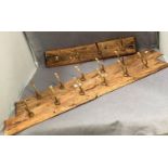 Three assorted coat hook racks in light wood (some brass hooks broken)