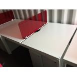 White steel framed double sided desk pod with two 3 drawer white metal mobile pedestals and a red