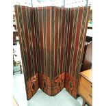 A four fold modesty screen in distressed condition each section 37cm x 170cm high