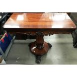 A Victorian rosewood swivel top tea table 92 x 92cm when open on single column tripod claw foot