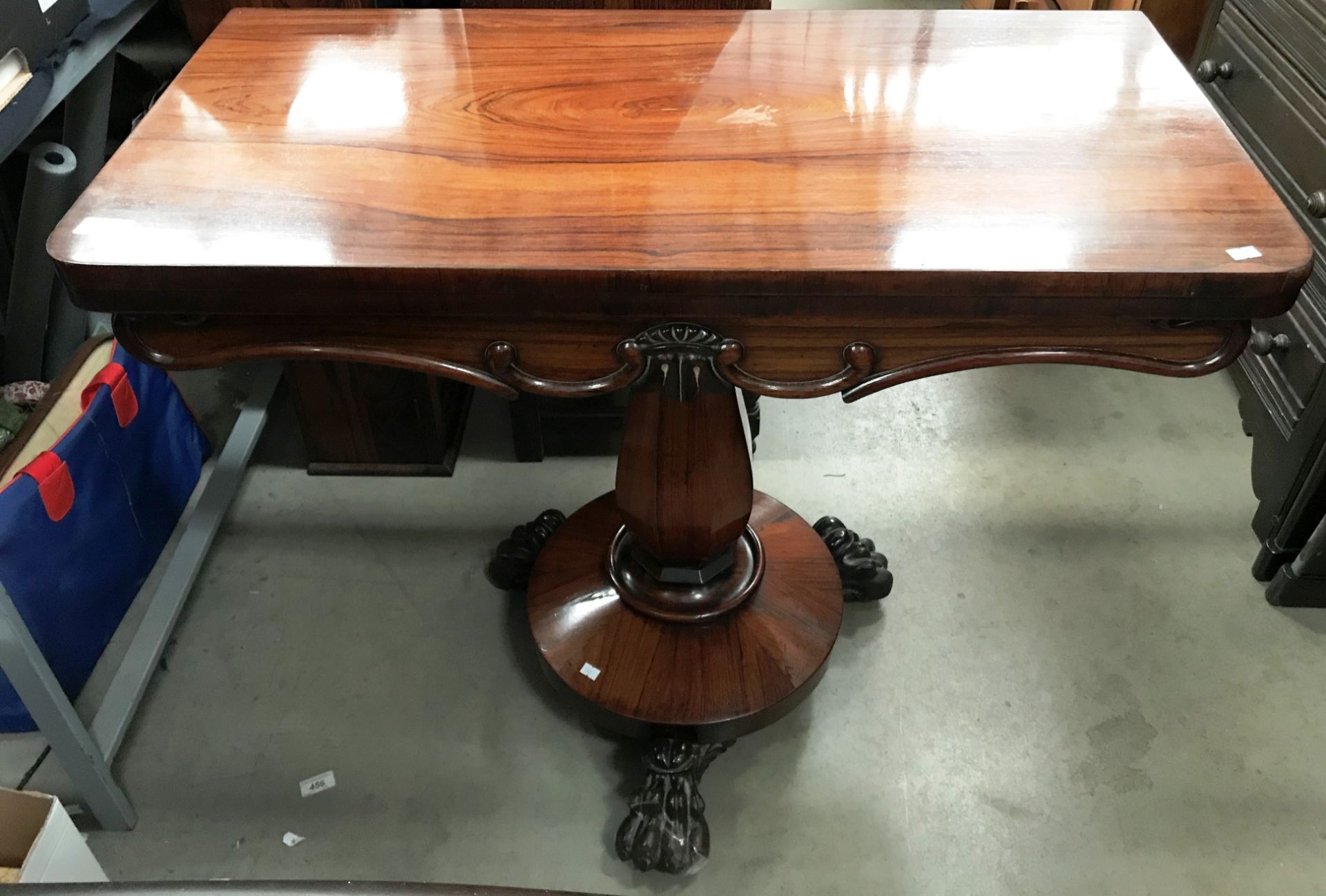 A Victorian rosewood swivel top tea table 92 x 92cm when open on single column tripod claw foot