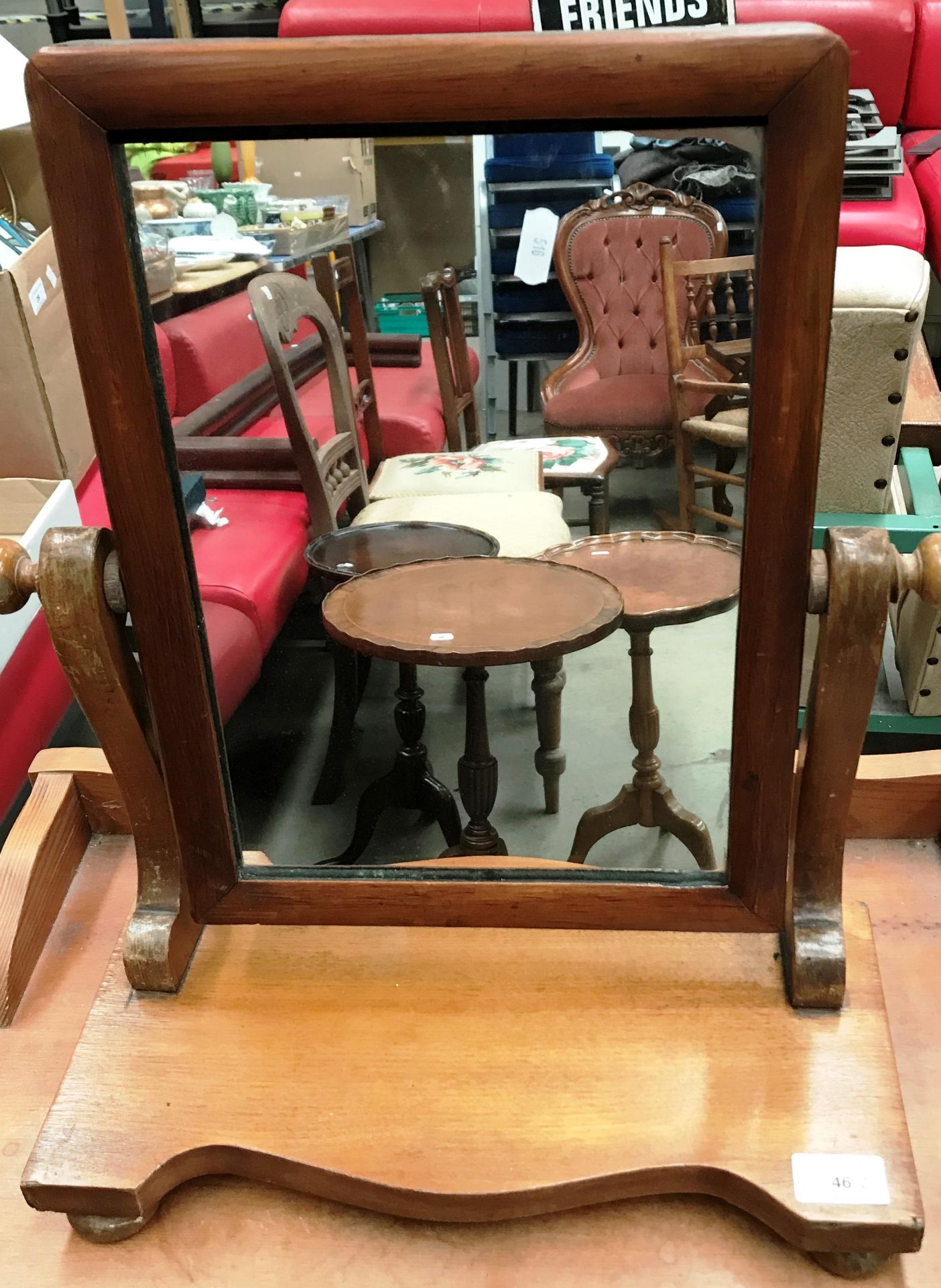 A small pine swing toilet mirror