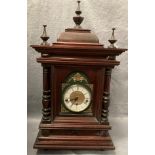 A mahogany framed mantel clock with brass and white face with Franz Hermle replacement movement 32