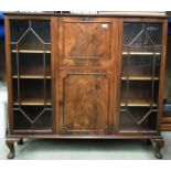 A mahogany and walnut bureau/display cabinet with two astragal glazed doors flanking a centre fall