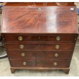 A George III mahogany bureau with fall flap and fitted interior over four drawers 97cm x 107cm high