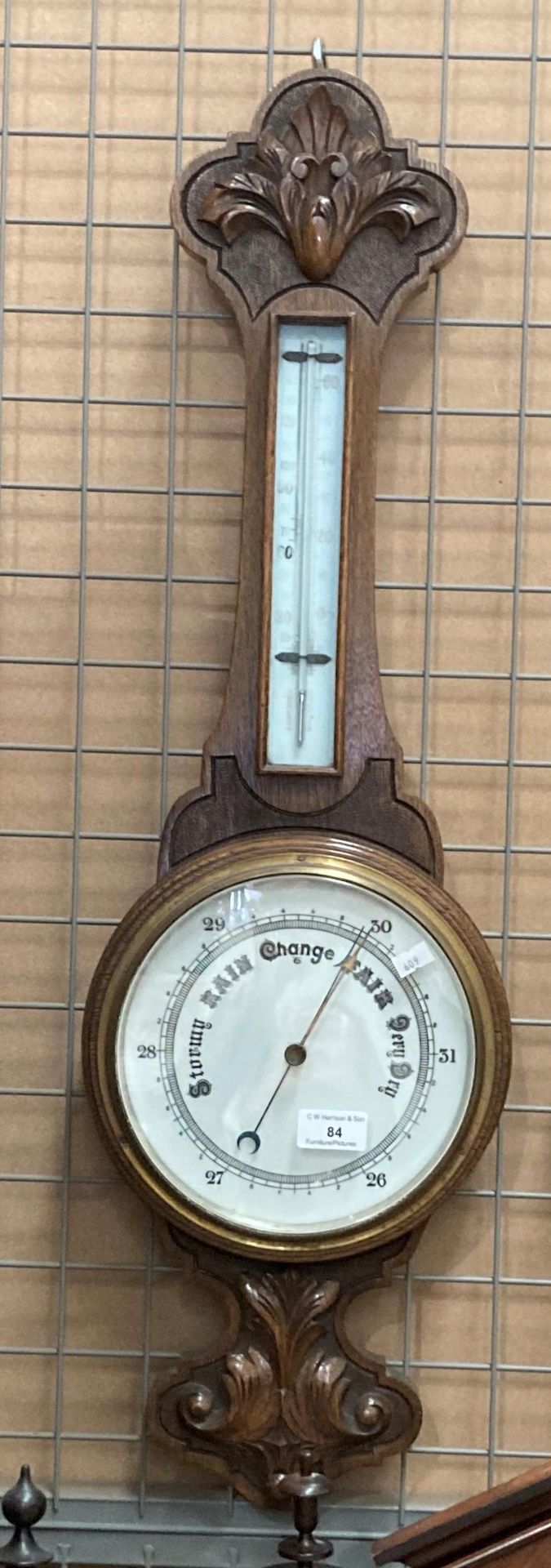 An oak cased wall barometer 80cm long